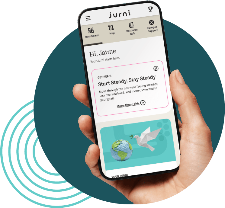 A hand holds a mobile device displaying a personalized view in the Jurni program.