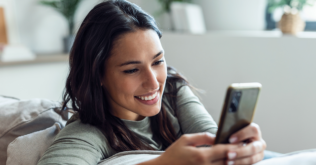 Smiling woman on her phone