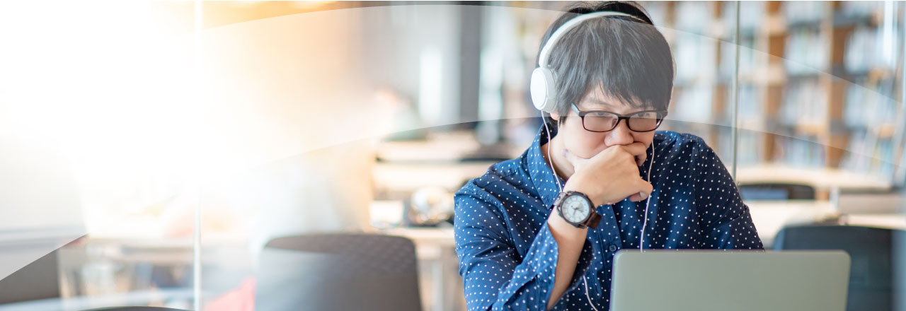 man using computer and thinking